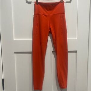 Athleta Transcend Stash Tight in Orange